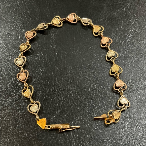 Beverly Hills Gold Jewelry - Beverly Hills Gold: 14k.tri colored gold heart shaped tennis 7” inch bracelet.